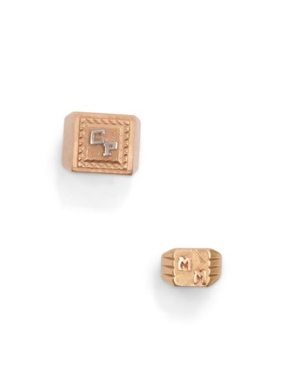null Two 750 thousandths yellow gold signet rings, each with a monogrammed center.
(Wear)
Gross...