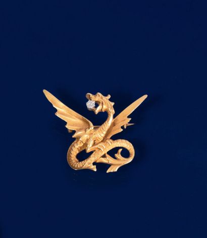 null 750 thousandth yellow gold engraved and diamond brooch featuring a dragon holding...