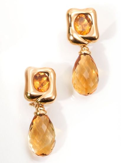 null Pair of 750 thousandths yellow gold earrings, each adorned with an oval citrine...