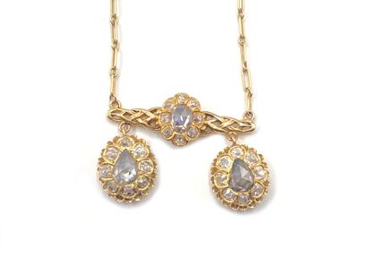 null Articulated necklace in 750 thousandths yellow gold, the center decorated with...