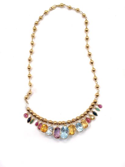 null Articulated necklace in 750 thousandths yellow gold decorated with gold balls,...