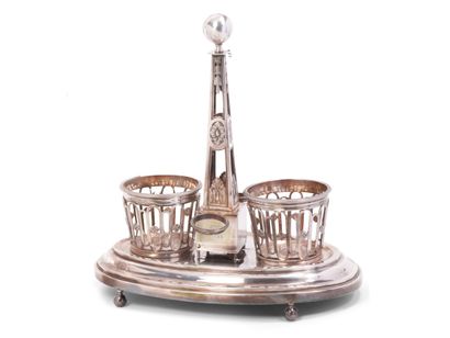 null A silver oil cruet with fleurons and foliage decoration, monogrammed, standing...
