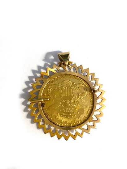 null 18k yellow gold pendant holding a $20 gold coin, 1899. 
Weight : 41 g 