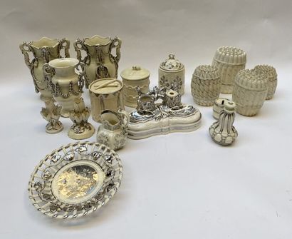 null LANGEAIS 
Set of shaped pieces with silvered relief decoration including baluster...