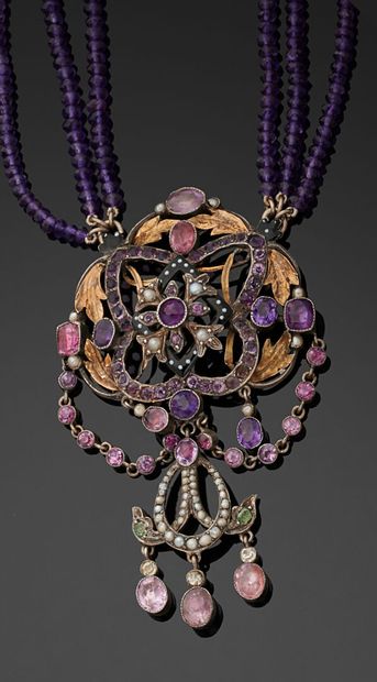 null Three-row necklace of faceted amethyst balls holding a central 800 thousandths...