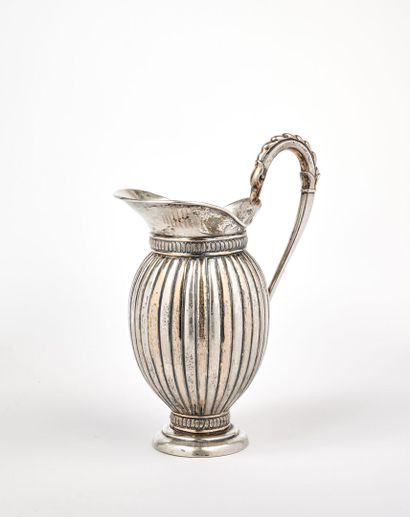 null A baluster-shaped 925-milliliter silver ewer on a pedestal with gadroon decoration,...