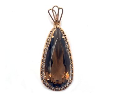 null Pendant in 585 thousandths yellow gold with a pear-shaped brown quartz in the...