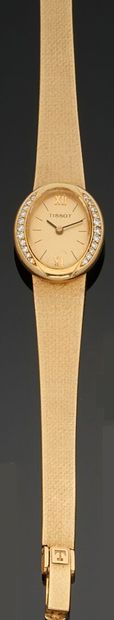 null Montre bracelet de dame en or jaune 750 millièmes, la montre de forme ovale,...