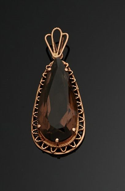 null Pendant in 585 thousandths yellow gold with a pear-shaped brown quartz in the...