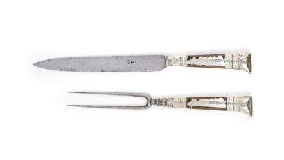 null Travel knife and fork with two prongs, horn and silver handles, metal tops.
Probably...