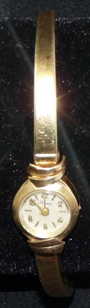 null Montre bracelet de dame, ronde, en or jaune 14 K (585/000), le bracelet rigide...
