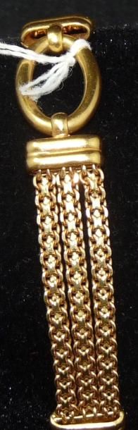 null Bracelet souple en or jaune composé de trois brins alternés de maillons ovales....
