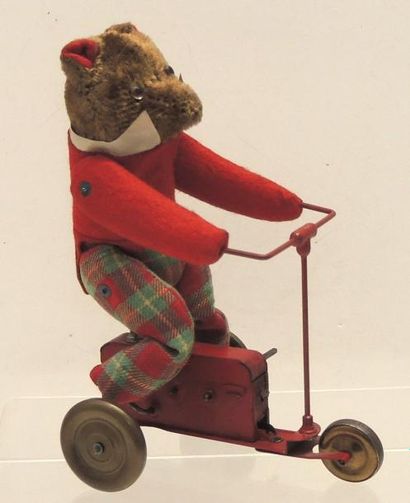 null Jouet mécanique figurant un ours sur un tricycle 1920-1930