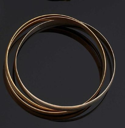 null BRACELET trois anneaux entrelacés en or de trois tons 18 k (750°/oo). Poids:...