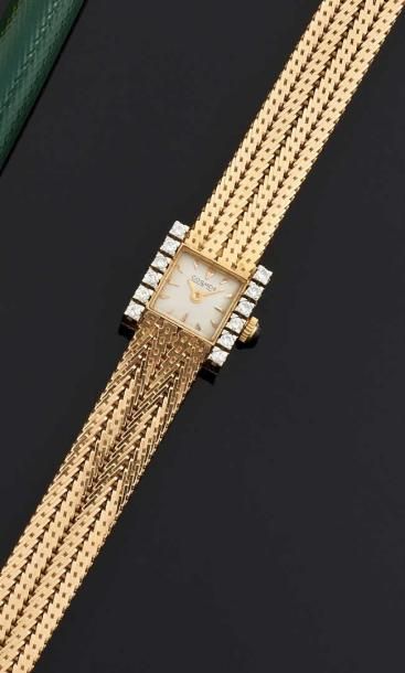 COSMOS Montre-bracelet de dame en or jaune 18 k (750°/oo). La montre de forme carrée,...