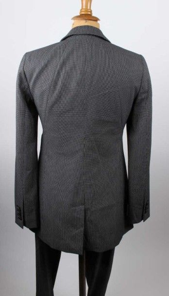 Emporio ARMANI Tailleur en lainage noir à pois blancs composé d'une veste à col cranté,...