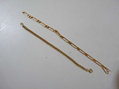 null Lot de deux bracelets articulés en or jaune 18 k, les maillons de forme ronde...
