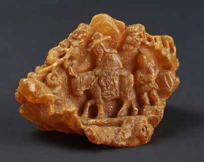 CHINE - XIXe siècle 
Groupe en copal, dit ambre jeune, cavalier sur une mule suivi...