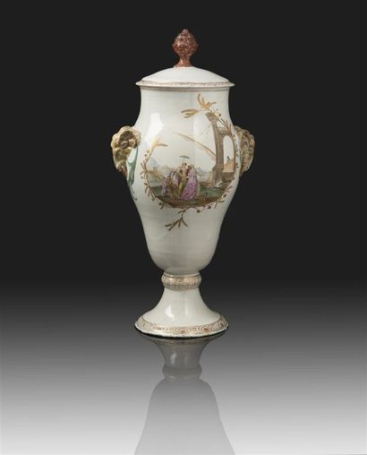 MARSEILLE Grand vase en faïence de forme balustre couvert muni de deux anses en forme...