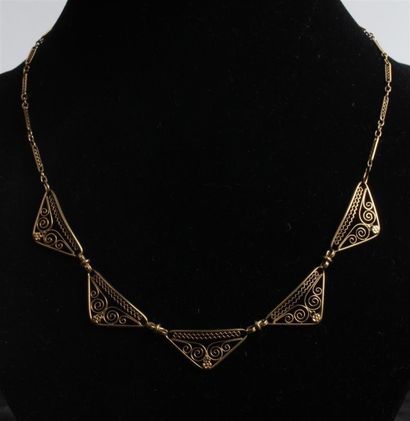 null COLLIER articulé en or jaune 750°/oo, les maillons de forme ovale et ronds alternés,...