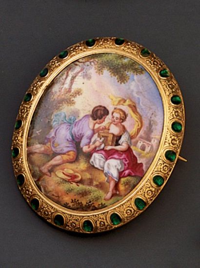 null BROCHE ovale en or jaune, sertie d'un émail polychrome "'Allégorie de l'Amour"...