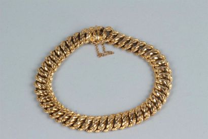 null Bracelet articulé en or jaune 750 millièmes, les maillons de forme ovale entrelacés...