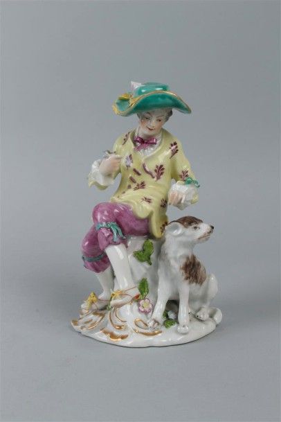 null SAXE - Groupe en porcelaine polychrome figurant un élégant au chien. XIX°siècle....