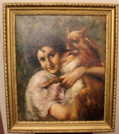 null "Jeune femme tenant un chien dans les bras" Huile sur toile signée en bas à...
