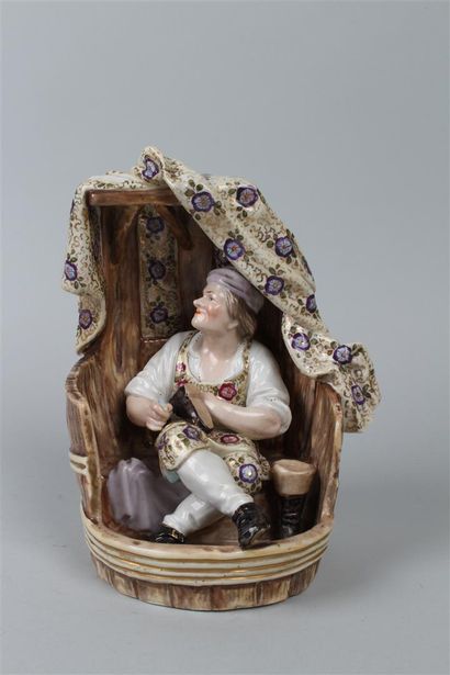 null NIDERVILLER 
Groupe en porcelaine à décor polychrome à décor au naturel d'un...