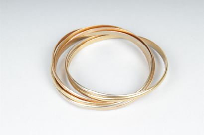 null CARTIER, MODÈLE TRINITY
Bracelet rigide composé de sept anneaux entrelacés en...