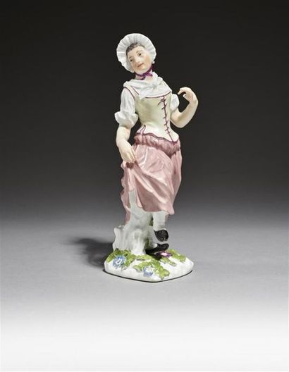 null MEISSEN
Statuette en porcelaine représentant une villageoise debout effectuant...