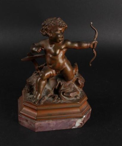 null D'après Gustave DORE 
Sujet en bronze à patine rouge présentant un cupidon sur...