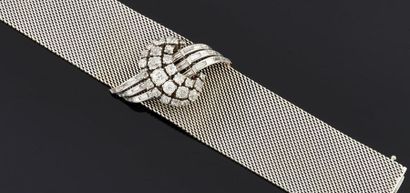 null ETERNA
Montre bracelet large et souple en or gris 750°/oo et platine, le centre...