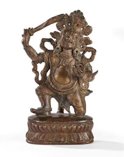 null TIBET - Vers 1900
Statuette en bronze de mahakala debout sur le double lotus,...