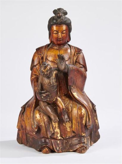 null CHINE - XVIIIe siècle
Statuette en bois sculpté à traces de laque or de guanyin...