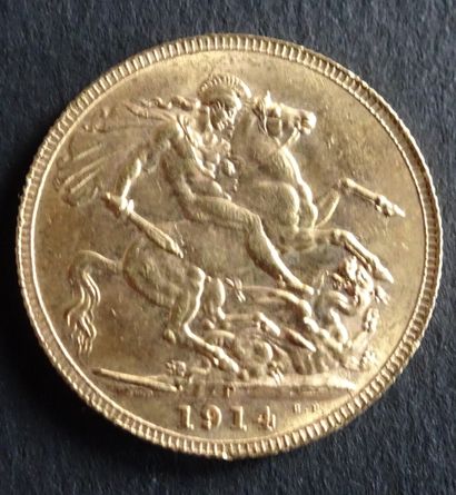 null Gold coin.Sovereign coin George V, Gold. 1914. Naked head of George V on the...