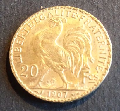 null Pièce OR. Pièce 20 francs Or au coq, 1907.
Poids : 6,46 g.