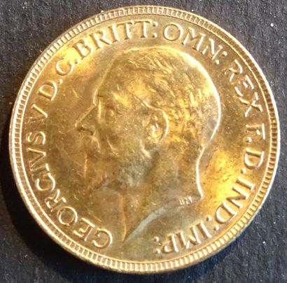 null Gold coin. Sovereign George V coin, Gold. 1931. Naked head of George V on the...