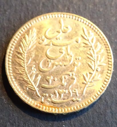 null Pièce OR. Pièce 20 francs OR Tunisie, 1901.
Poids : 6,46 g.
