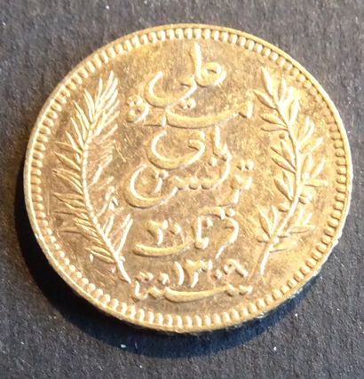 null Gold coin. Coin 20 francs GOLD Tunisia, 1892.
Weight : 6,46 g.
