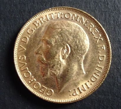null Gold coin.Sovereign coin George V, Gold. 1914. Naked head of George V on the...