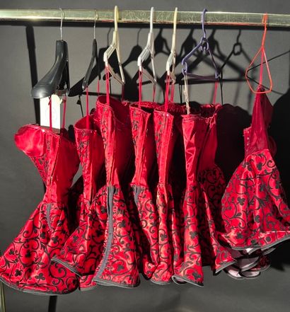 null 7 little red dresses with black print and red sequins.