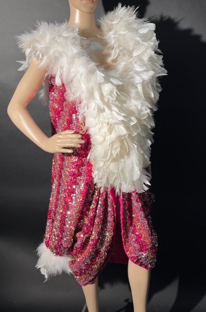null 6 1930s capes with red sequins and white feathers.