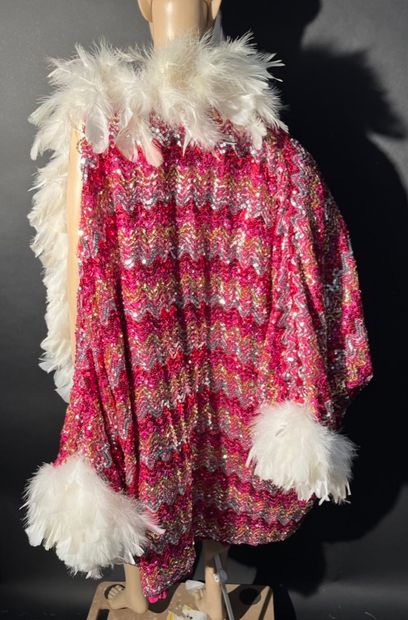 null 6 1930s capes with red sequins and white feathers.