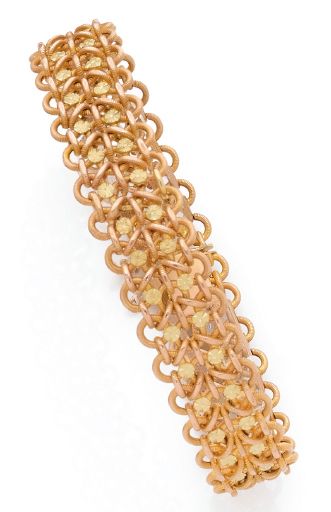 null BRACELET SOUPLE en or rose 18K (750) formé d'anneaux imbriqués et ponctué de...