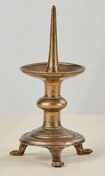 null Tripod bronze candlestick picnic, with a flattened sphere knot, flared cup,...