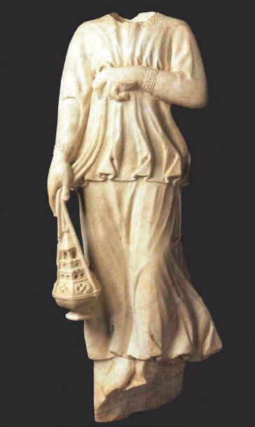 null Acephalus angel in marble. Standing, the angel stands with her arms crossed...