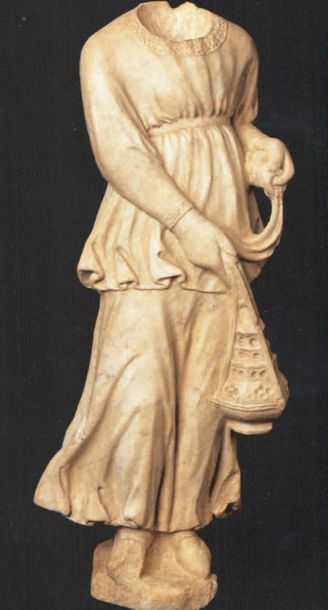 null Acephalus angel in marble. Standing, the angel stands with her arms crossed...
