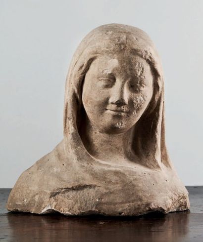 null Bust of a holy woman or Virgin in carved limestone.
Oval face, with a friendly...