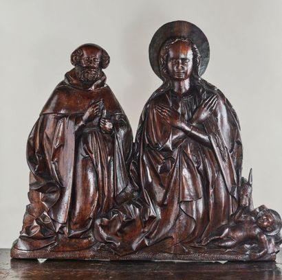 null Nativité en tilleul sculpté en bas-relief. Joseph et Marie sont agenouillés,...